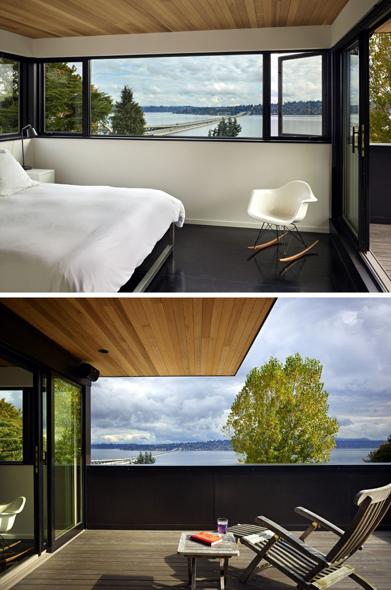 In this modern bedroom, a color palette of black and white is complemented with warm wood accents. The cantilevered roof provides a covered space for outdoor lounging. #BedroomDesign #WoodCeiling #Windows