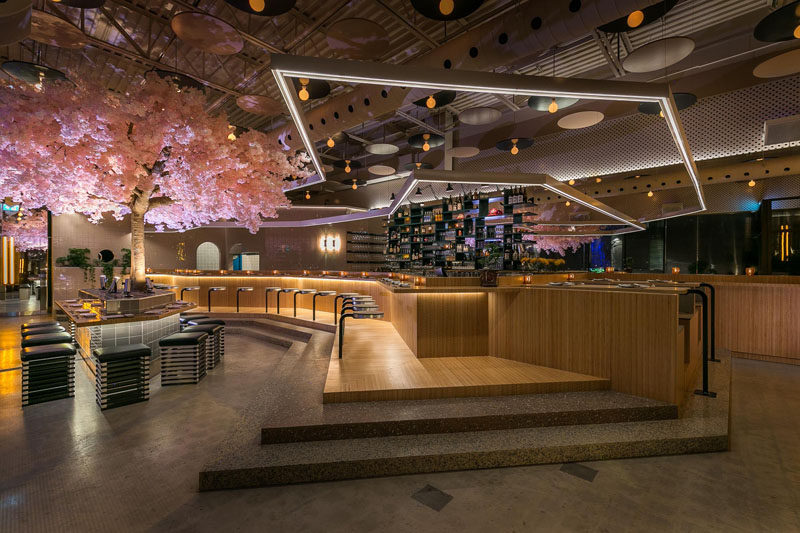 This modern Japanese restaurant has a cherry blossom tree that stands 16 feet (5m) in width and 11 feet (3.5m) high, making it the restaurant’s own “totem pole”. #RestaurantDesign #CherryBlossom