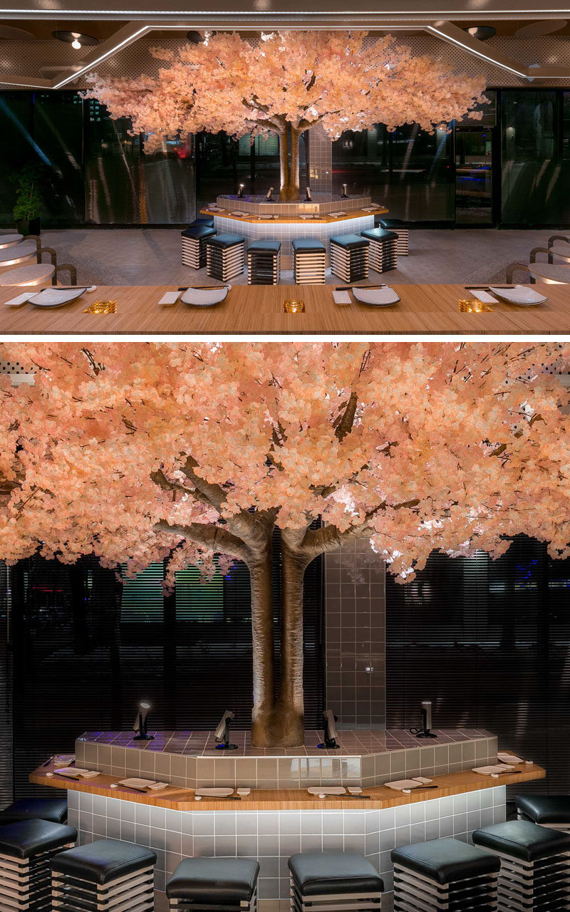 This modern Japanese restaurant has a cherry blossom tree that stands 16 feet (5m) in width and 11 feet (3.5m) high, making it the restaurant’s own “totem pole”. #RestaurantDesign #CherryBlossom