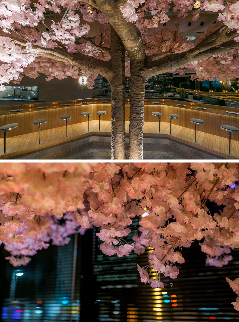 This modern Japanese restaurant has a cherry blossom tree that stands 16 feet (5m) in width and 11 feet (3.5m) high, making it the restaurant’s own “totem pole”. #RestaurantDesign #CherryBlossom