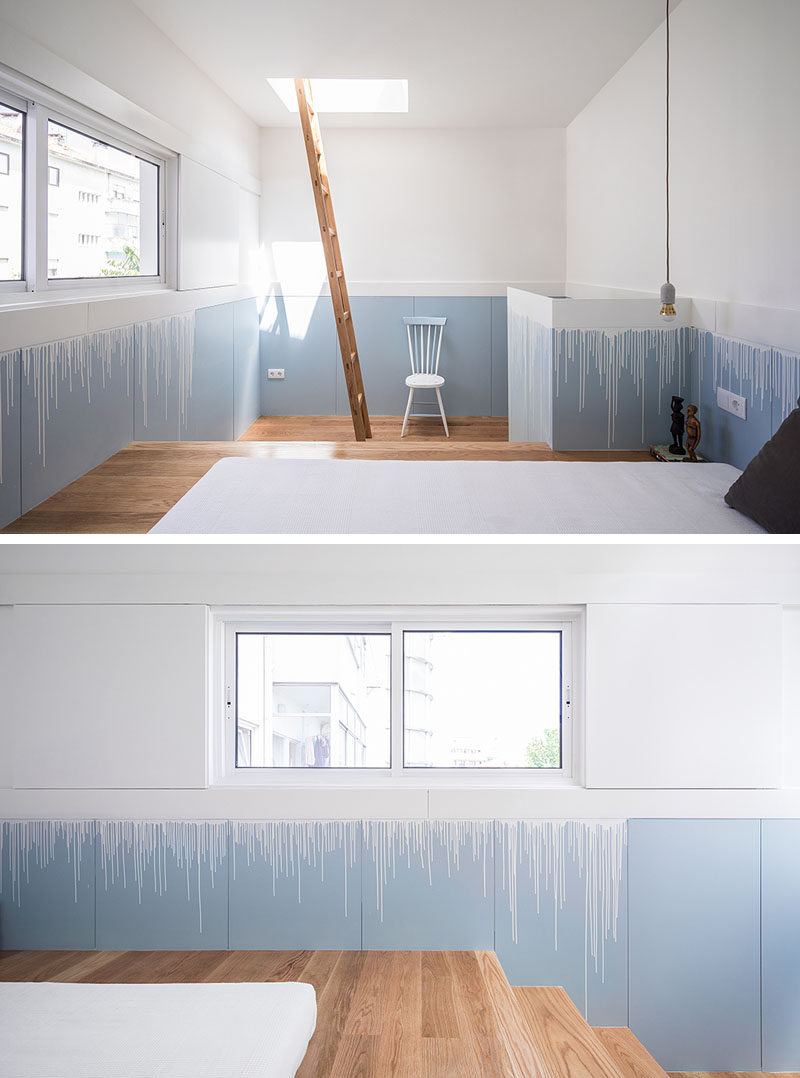 This modern bedroom has the lower half of the walls painted in the same blue as the kitchen and stairs, however a 'drip' effect has been used to transition between the white upper walls and the blue lower walls. #InteriorDesign #PaintColors #ModernBedroom