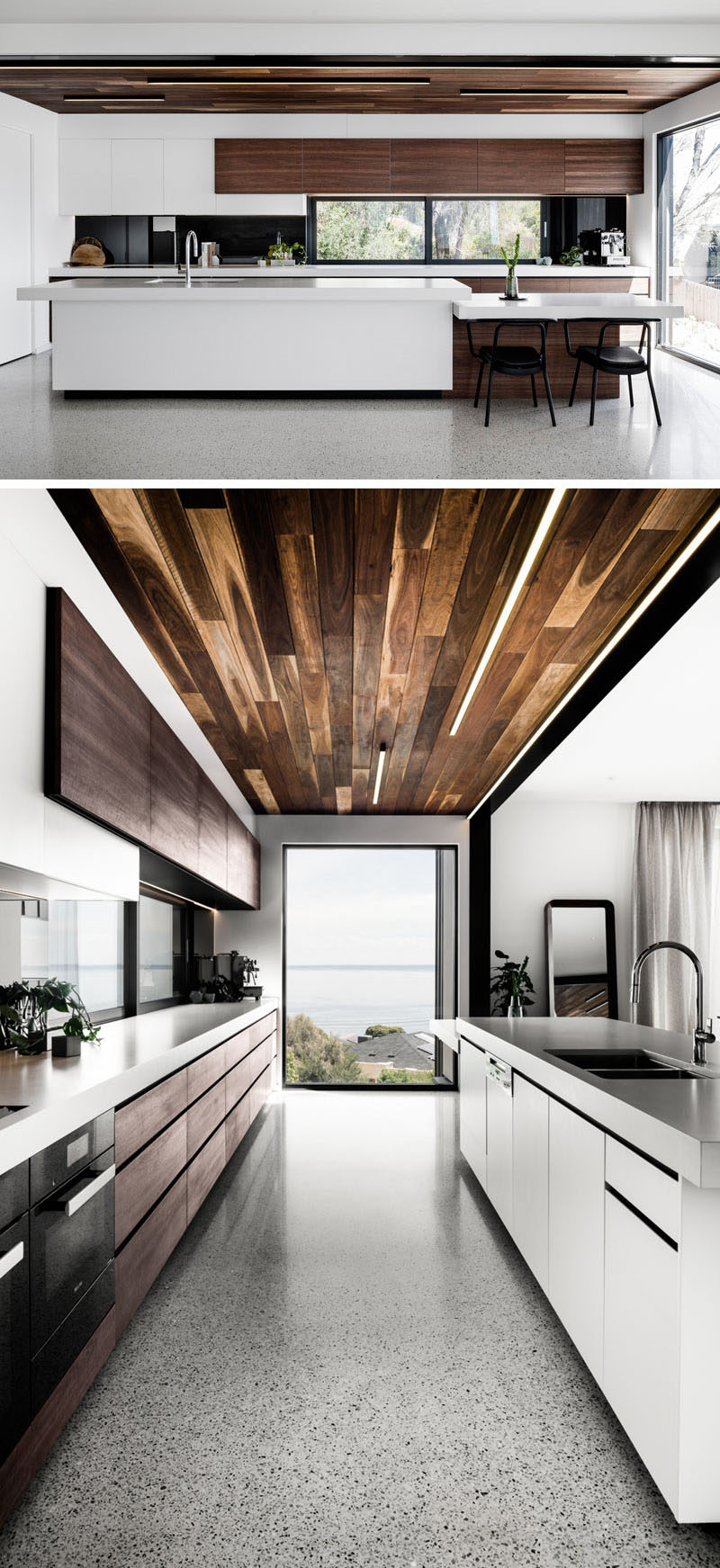 In this modern kitchen, the wood ceiling and wood cabinetry contrasts the bright white minimalist cabinets and kitchen island. A large window at the end of the kitchen has been positioned to take advantage of the sunset views. #KitchenDesign #ModernKitchen #WhiteAndWood