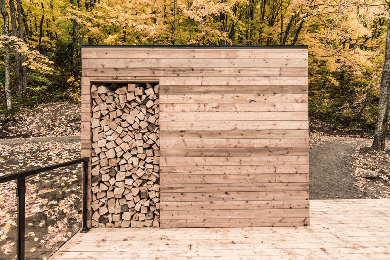 A small cabin has a separate firewood storage shed. #FirewoodStorage