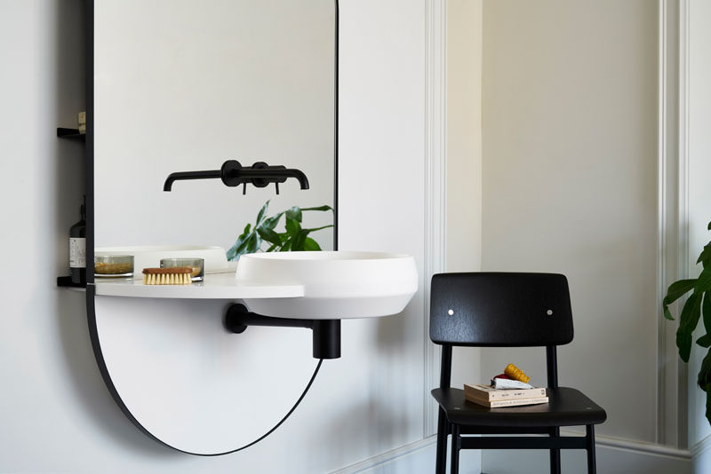 Mut Design studio have created ARCO, a multi-functional piece of bathroom furniture that has an integrated mirror, taps, washbasin, and shelving system hidden behind the glass. #Bathroom #BathroomMirror #ModernBathroom