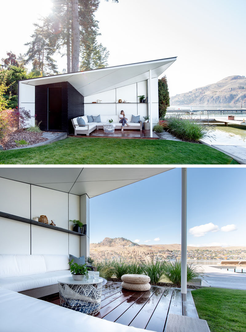 This modern lake house has a beach hut with an angled roof and a sitting area that's open to the elements. #BeachHut #OutdoorSpace #Architecture