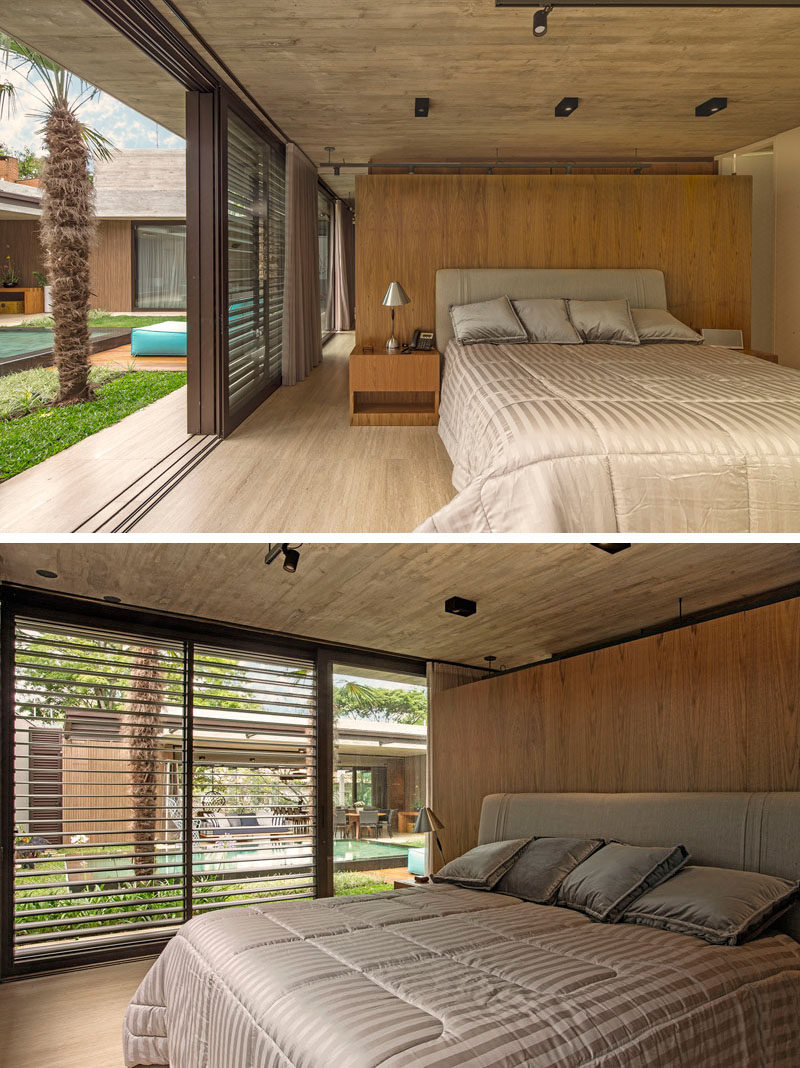 In this modern master bedroom, a wood accent wall adds a natural touch and a sense of warmth to the room. #Bedroom #ModernBedroom #BedroomDesign