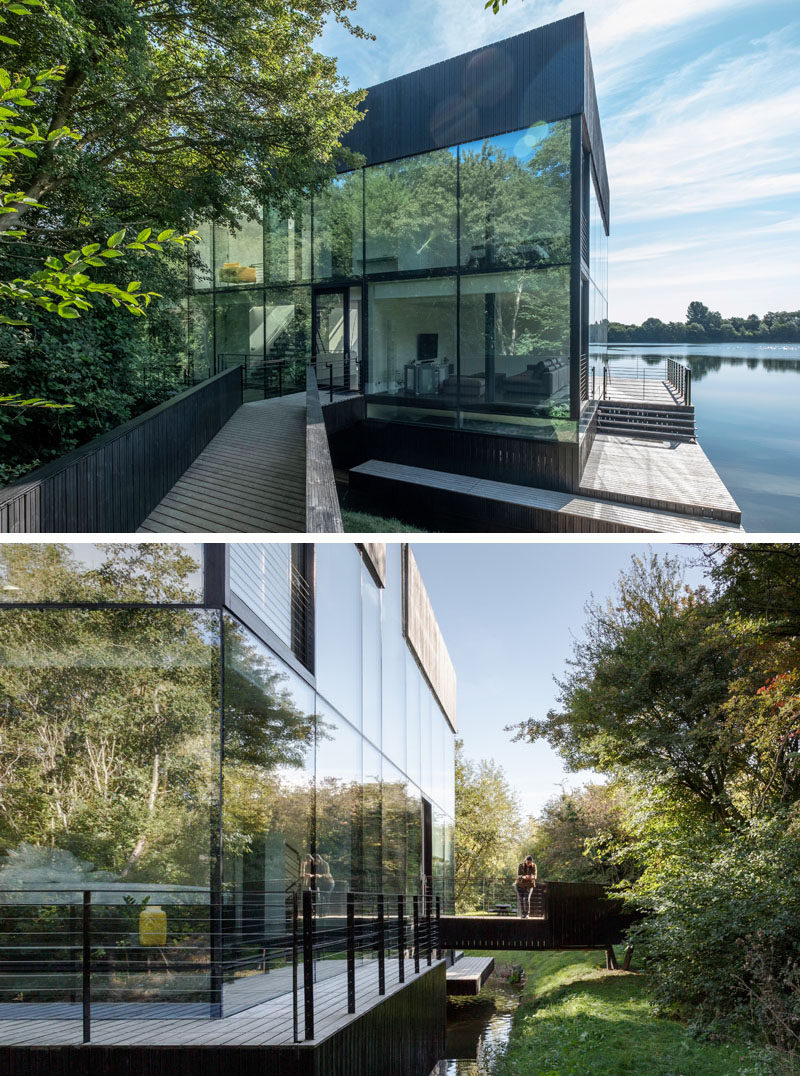 Mecanoo architecten have designed a modern house that sits on a lake in Lechlade, England, and features a walls of glass, enabling expansive views from the home's interior. #Architecture #HouseDesign #LakeHouse