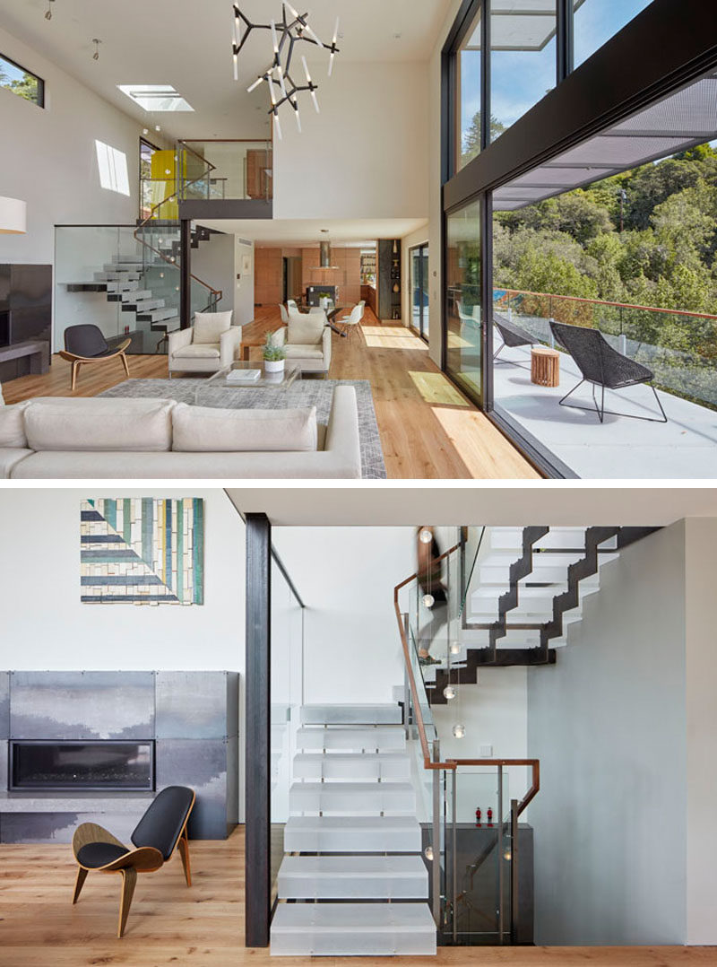 Stairs, made from laser cut steel plate stringers and clear acrylic treads with a sanded finish, lead from the foyer down to the social areas of this modern house. #Stairs #ModernStairs