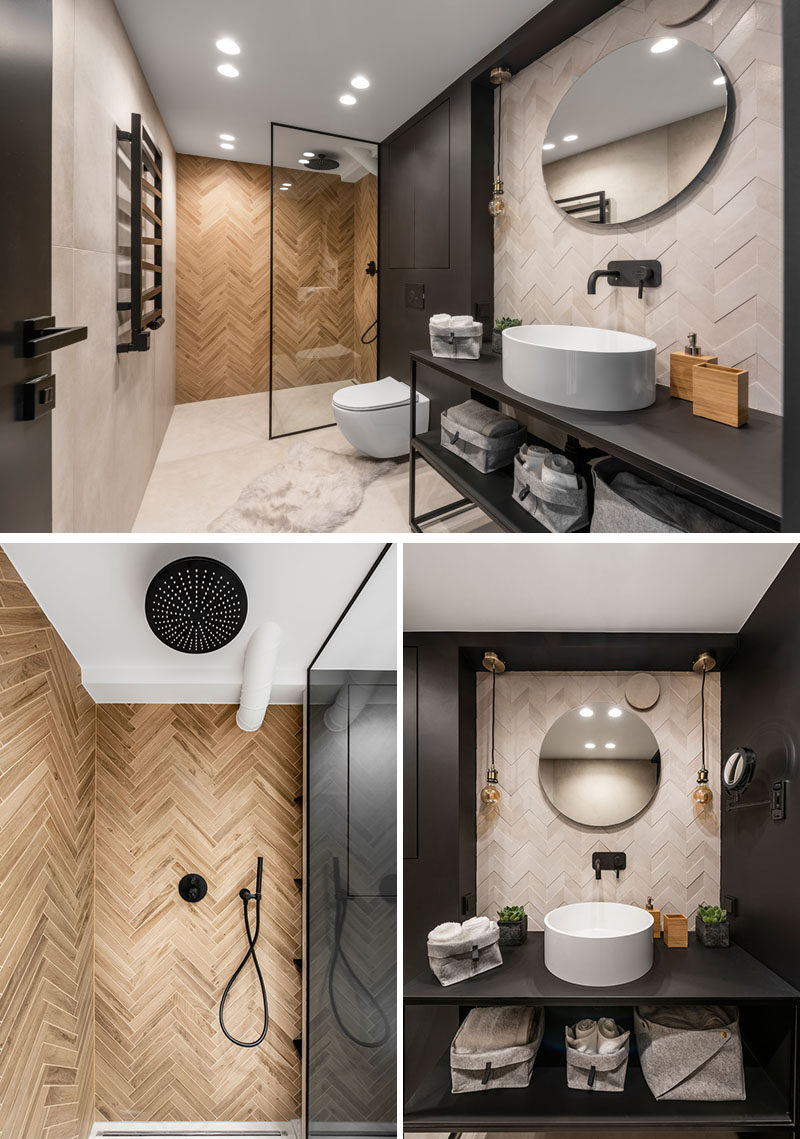 This modern bathroom features tiles installed in both herringbone and chevron patterns. #ModernBathroom #BlackBathroom #InteriorDesign