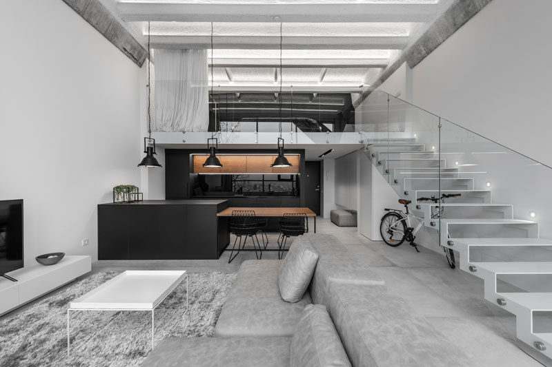 Design firm IDwhite has recently completed the interiors of a modern industrial loft in Kaunas, Lithuania. #ModernLoft #IndustrialLoft #InteriorDesign