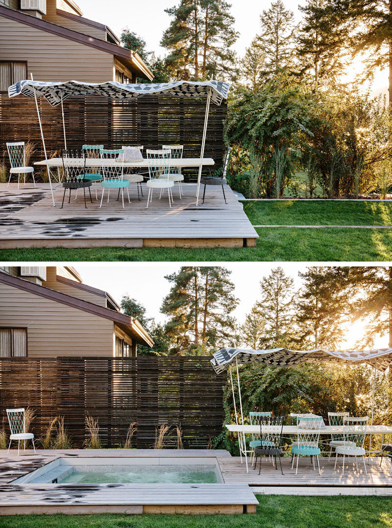 The deck of this modern outdoor space can slide along rails to reveal a hidden hot tub. #HotTub #Deck #OutdoorDining
