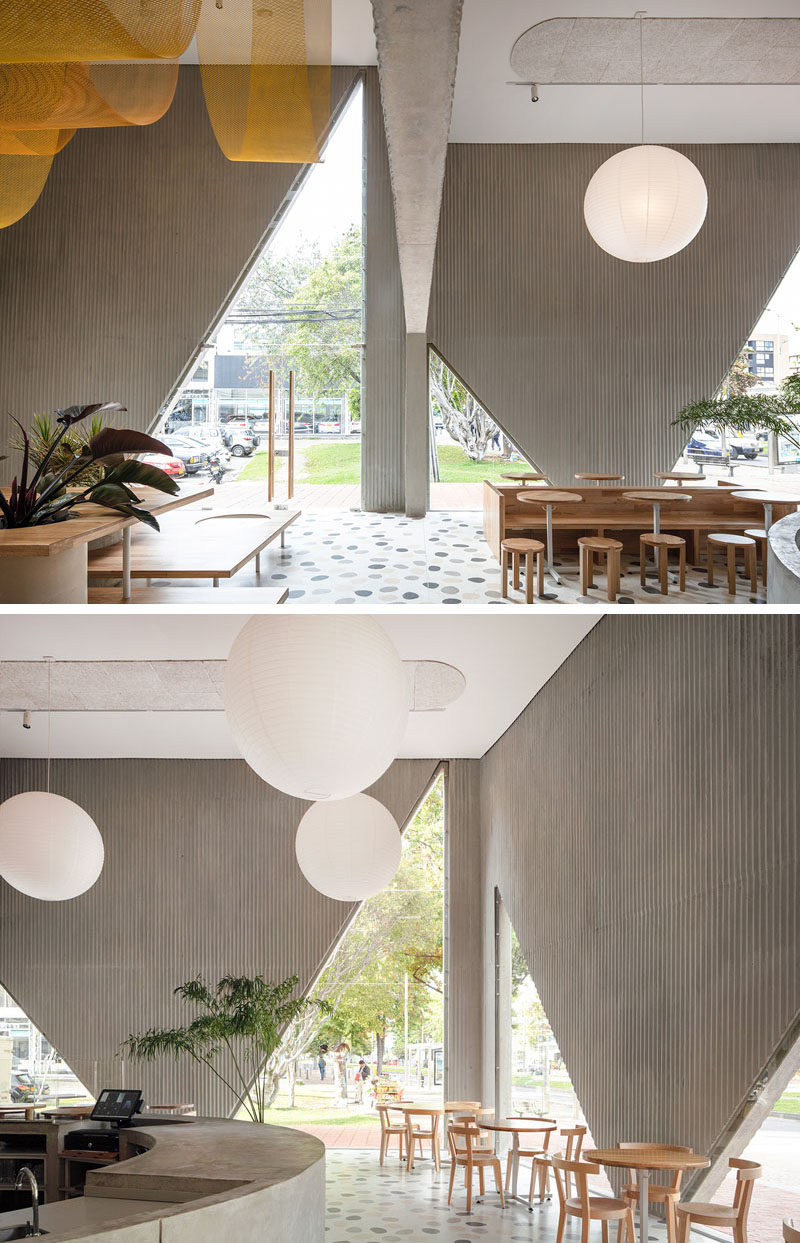 Triangular cutouts open the facade of this restaurant to better connect at sidewalk level while revealing a glimpse of the interior. #Restaurant #Cafe #Windows