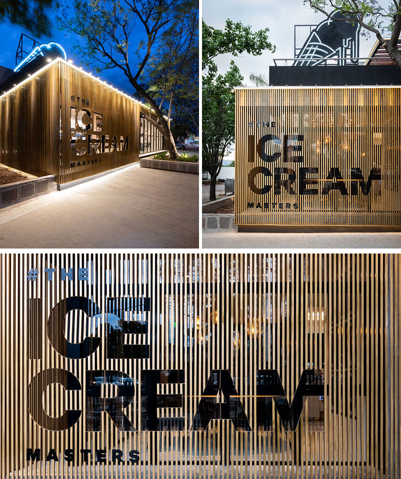 Materials used throughout this modern cafe include concrete, stone, wood, ceramic, marble, and iron. The sign on the exterior of the cafe has been 'cut-out' from the wood slat siding. #Signage #CafeDesign