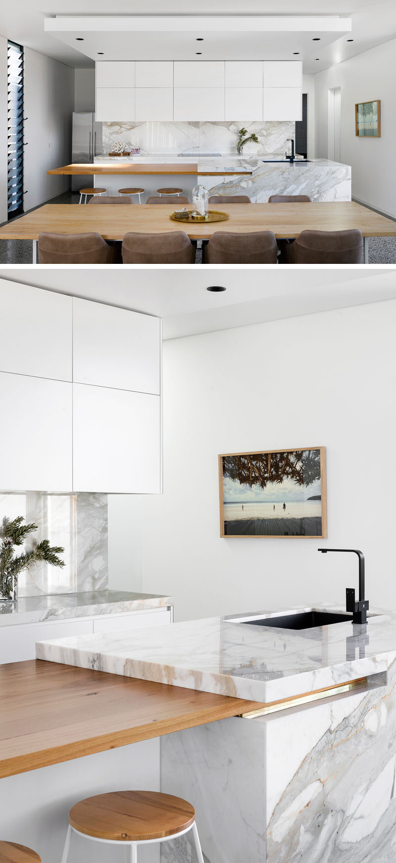 In this kitchen, white cabinetry is combined with stone and a wood countertop for a modern look. #ModernKitchen #KitchenDesign