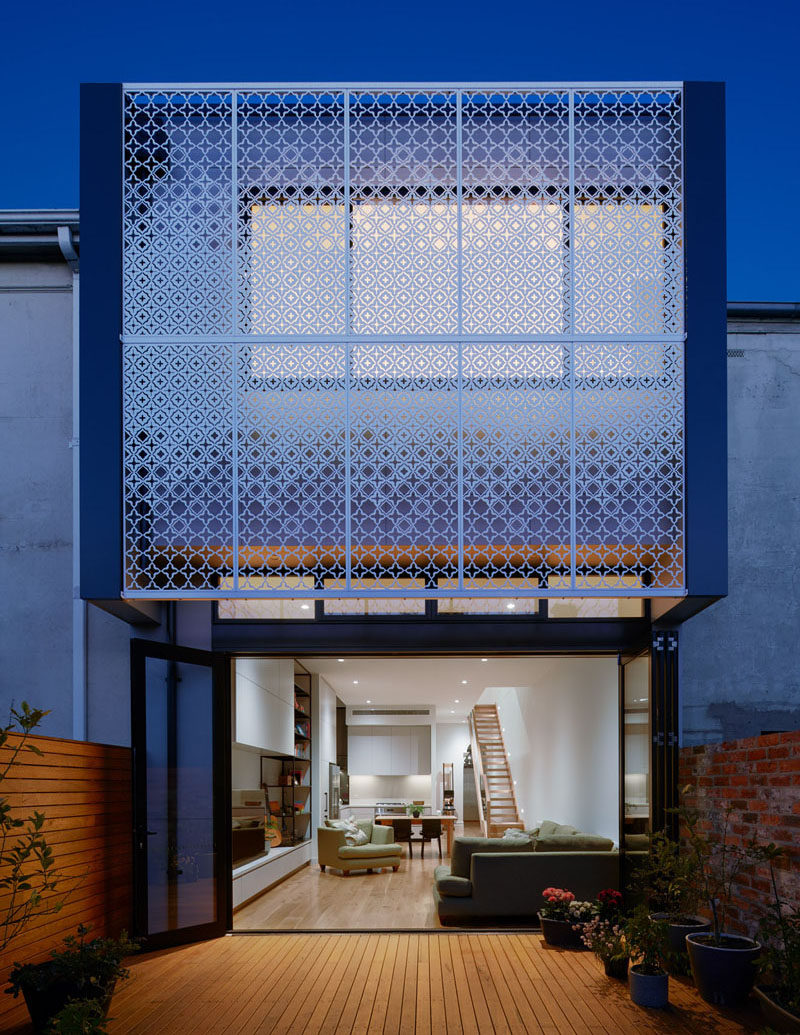 Chan Architecture have added a custom-designed metal screen to this house, providing a decorative accent and privacy to the interior of the home. #Facade #Screen #Architecture