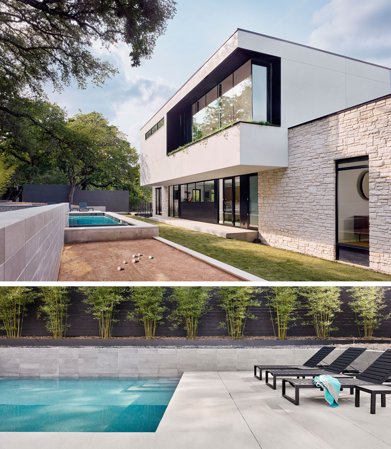 The backyard of this modern house has a variety of levels with a bocce court and a swimming pool. #ModernHouse #Backyard #SwimmingPool #BocceCourt #Landscaping