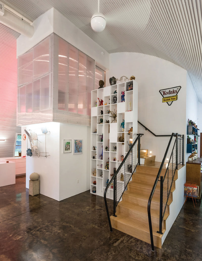 The stairs, the loft and the shutter polycarbonate windows allow visitors to experience the tallness of this modern house.. #Stairs #InteriorDesign #Shelving