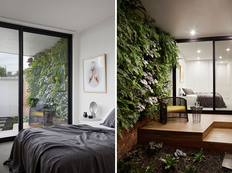 This modern bedroom has access to a small covered wood deck with a green wall that looks out onto the garden.  ModernBedroom #Garden #Greenwall #Deck