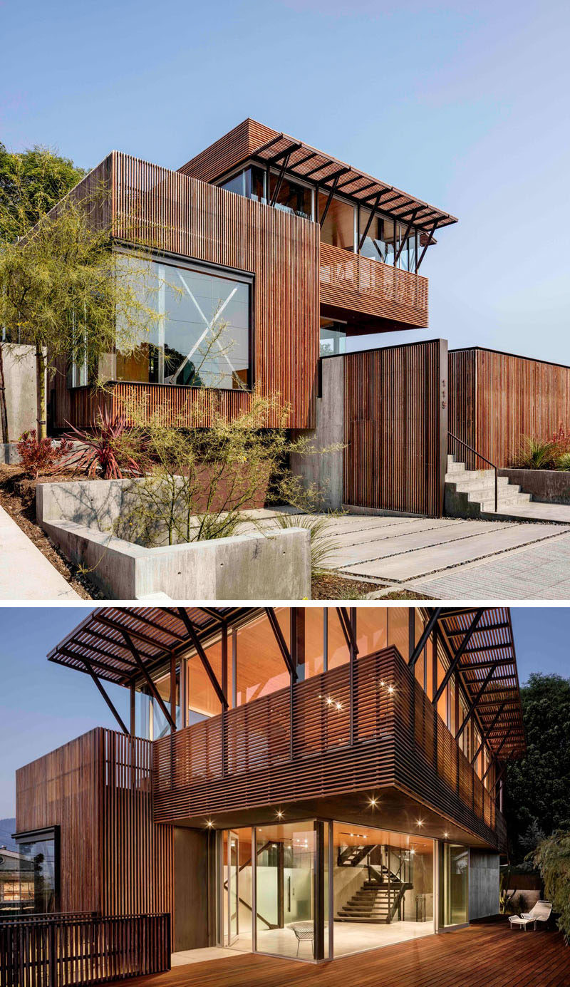 Ipe wood screens cover the exterior of a modern house.