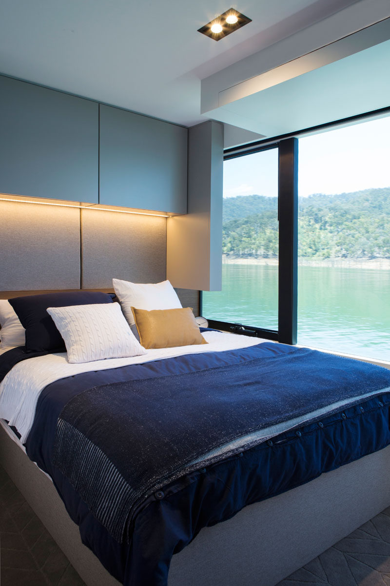 This modern houseboat has beds that elevate to reveal hidden storage underneath. #Bedroom #Houseboat