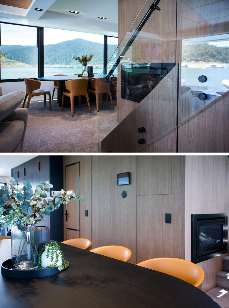 The dining room on this modern houseboat features a dark wood oval table large enough to seat 8 people. #DiningRoom #Houseboat