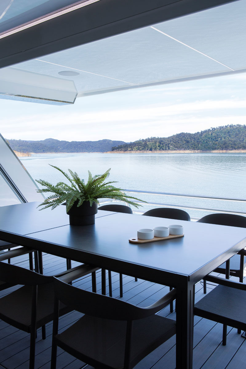 This modern houseboat has a covered alfresco dining area. #AlfrescoDining #HouseBoat