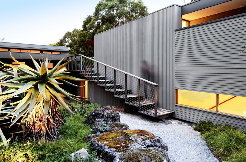 A new external staircase was added to this modern home to provide access to the rooftop deck. #ExternalStairs #StairDesign