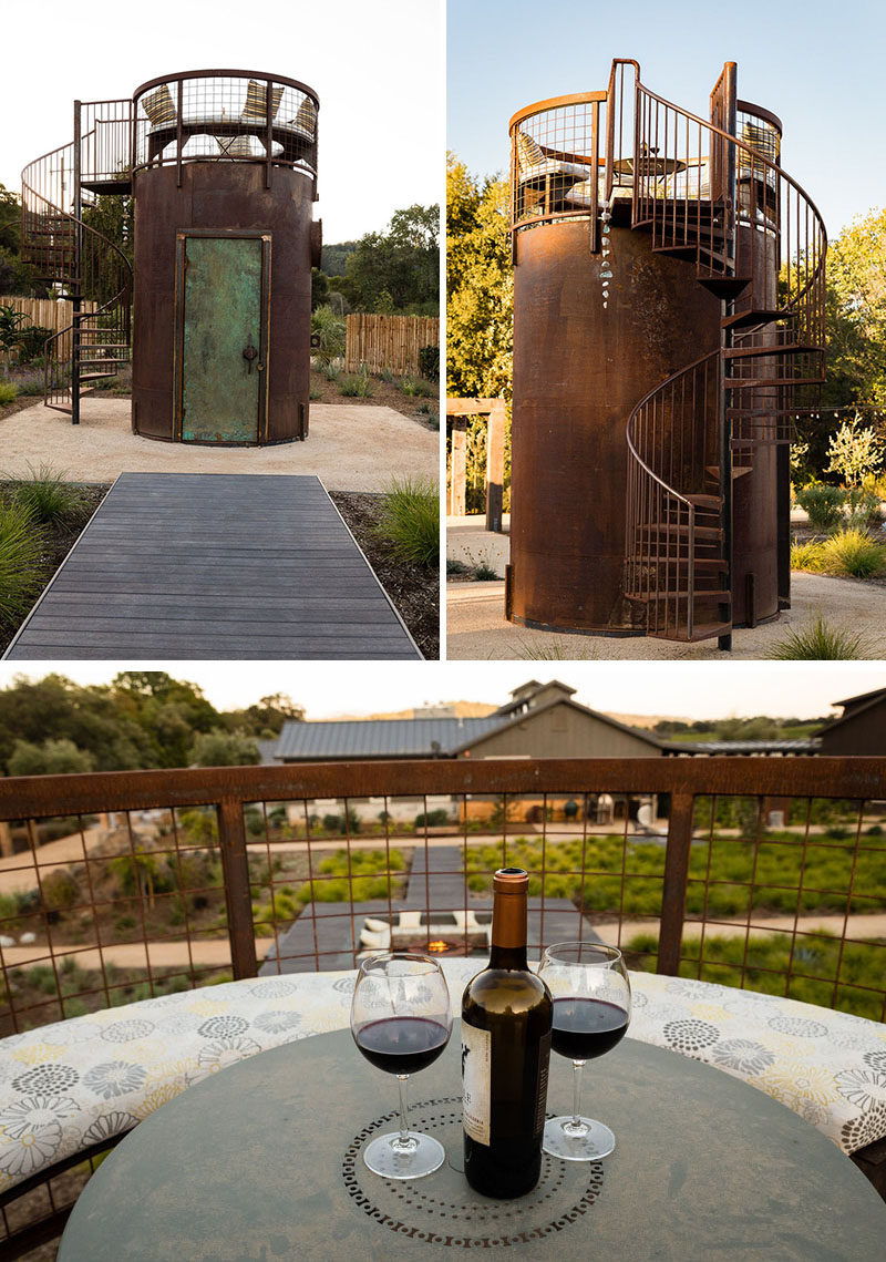 To experience an alternate view of this backyard and to enjoy stargazing, a small steel tower has a spiral staircase that leads up to a seating area with a curved bench and a small table. #Backyard #Landscaping #Design