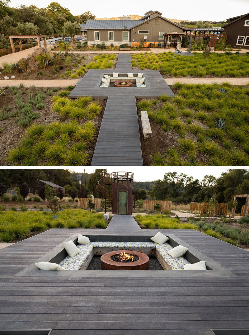 Central to this landscaped backyard is a raised wooden pathway that leads to a large sunken lounge with bench seating and a fire pit. #SunkenLounge #Landscaping #Firepit