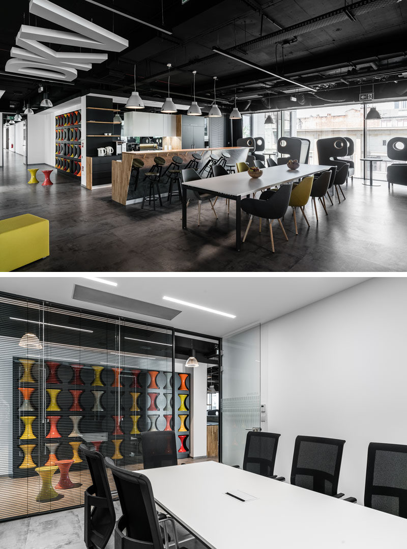 This modern office has a wall with cut-outs, that's dedicated to the storage of hourglass stools. When the stools aren't in use, they are placed into the empty spots in the wall, creating more room for walking around. #Stools #OfficeDesign #Workplace #WallStorage