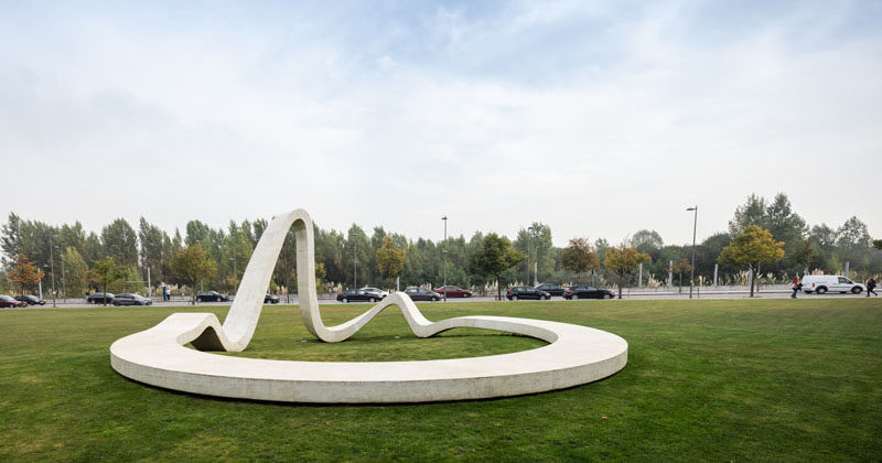 This modern concrete sculpture has been designed to allow people to relax and enjoy the design, with various high and low points creating places to sit or lean. #Sculpture #PublicArt
