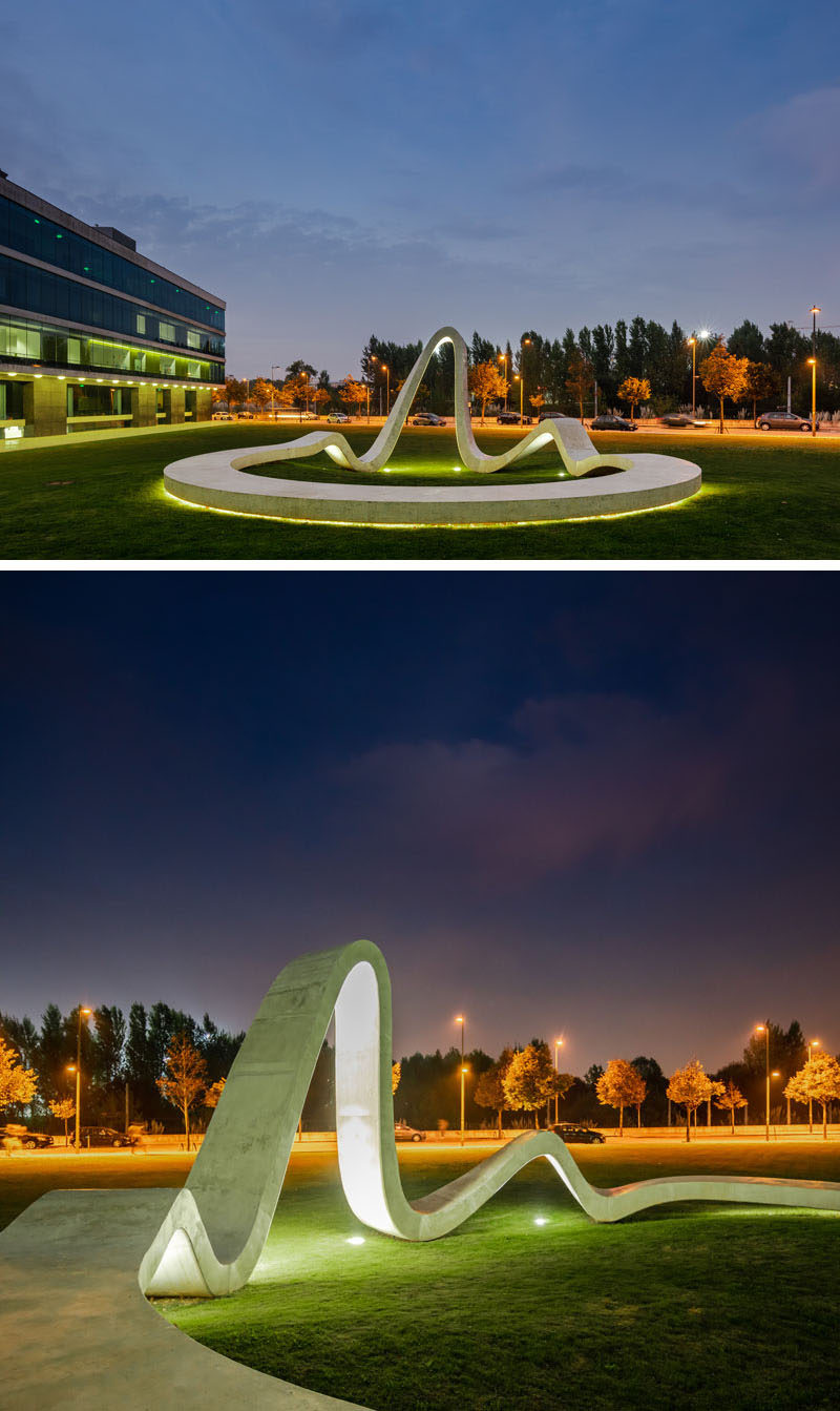 At night, lighting highlights the form of this modern sculpture and draws attention from people passing by. #Sculpture #Art