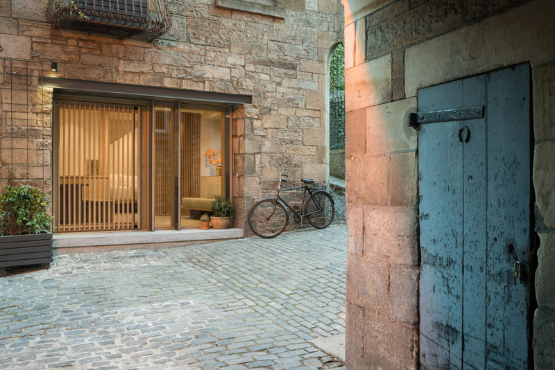 A young couple have transformed a former 18th century blacksmiths workshop into a minimal holiday retreat using natural materials and local craftsmanship. #HolidayRental #Architecture #InteriorDesign