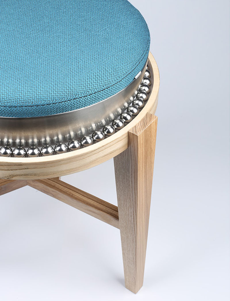 Ball Bearings Allow The Seat Of This Wood Stool To Move Freely