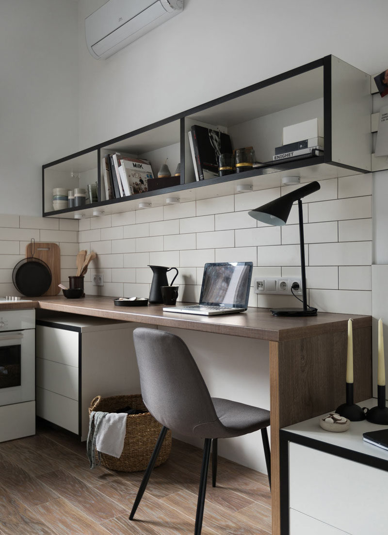 In this small apartment, the bedside table meets a wooden work desk, and above the desk is a floating shelving that can be used as a bookshelf and as a open pantry. #Desk #HomeOffice #InteriorDesign