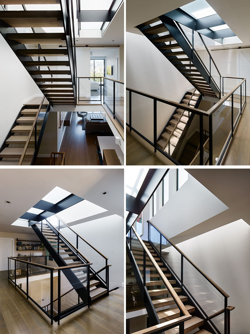 A staircase, comprised of solid oak treads and a steel and glass rail, connects all four levels of this modern house, channeling light from multiple skylights and diffusing it throughout the interior living spaces from the roof deck to basement. #Stairs #Staircase #ModernStairs