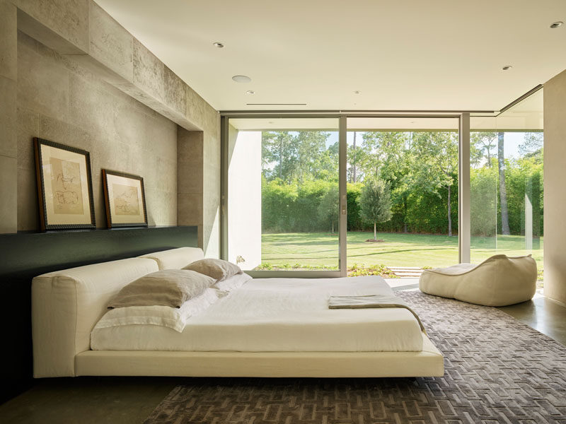 The master suite at the back of this modern house is soothingly minimal, with the bedroom, spa bathroom and study all opening to secluded gardens. #Bedroom #MasterBedroom