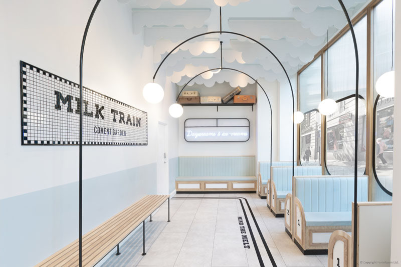 FormRoom have designed 'Milk Train', a modern ice cream cafe that's inspired by the design of the British underground trains and their stations. #ModernCafe #CafeDesign #InteriorDesign