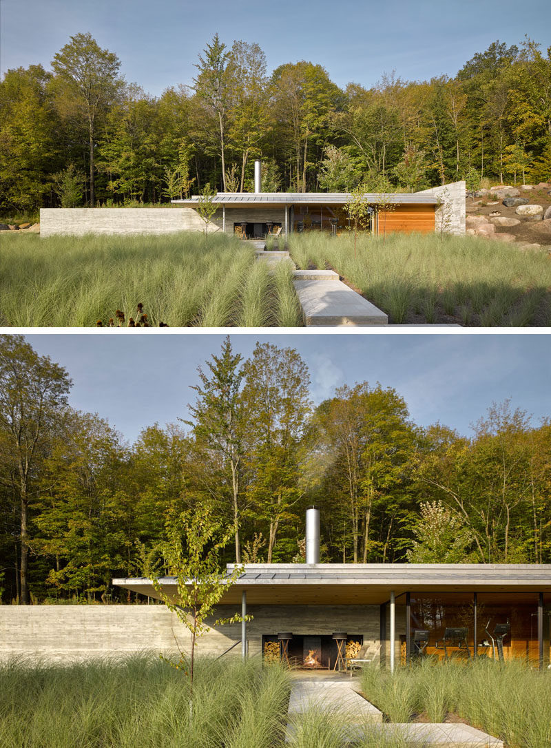 This modern concrete, wood, and glass pool house sits next to an infinity lap pool and hot tub, and features an outdoor fireplace, a gym, lounge, and changing areas. #PoolHouse #SwimmingPool #Architecture