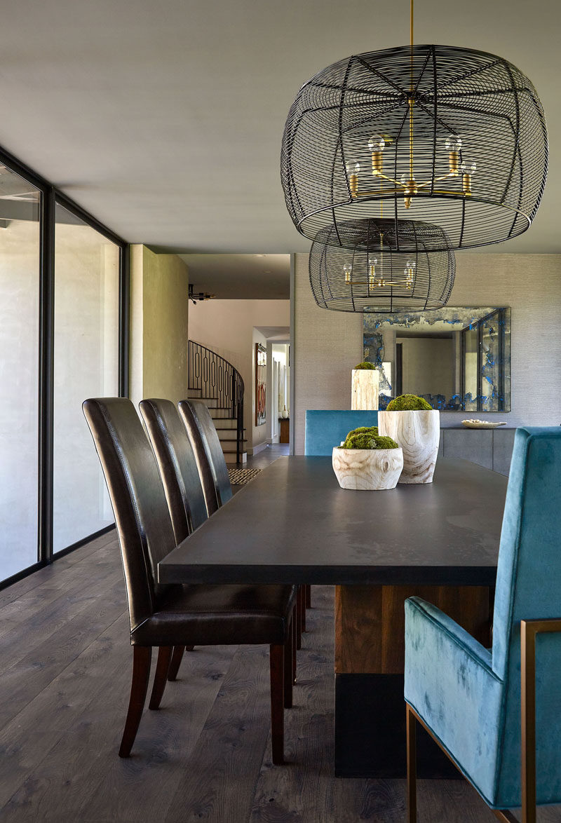 This dining room is located within a bridge with glass walls, that connects the various areas of the house. #DiningRoom