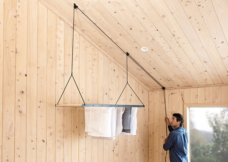 George and Willy have created a modern hanging drying rack, that's suspended from the ceiling using a seamless pulley system, allowing the clothes rack to quickly dry laundry by utilising warm air trapped in the ceiling space. #HangingDryingRack #Design #Laundry