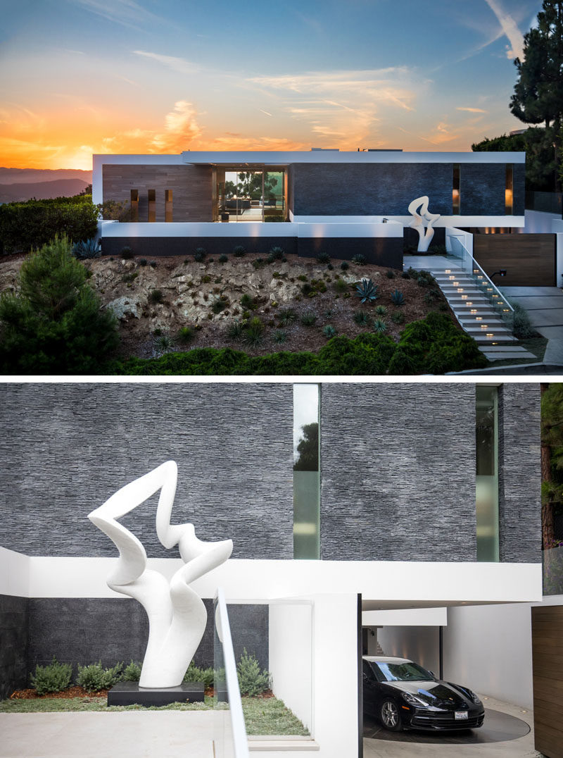 Guests coming up the front steps of this hilltop home are met with a Carrera marble sculpture by Richard Erdman, titled 'Serenade', while the car park features a turntable that identifies each car, rotates it to a preset angle that enables the driver to exit with ease. #ModernHouse #HouseDesign #Architecture