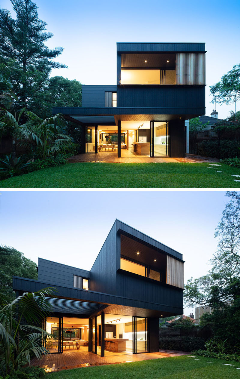 The backyard of this modern house acts as an extension of the indoor living spaces, which smoothly transition into the outdoor thanks to large expanses of glass. #Backyard #ModernArchitecture #HouseDesign