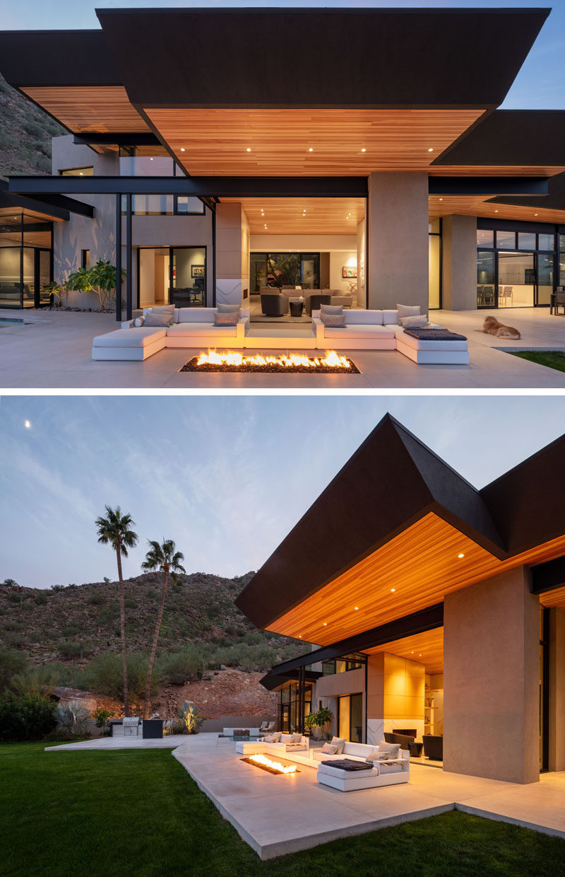 Central to the large patio of this modern house, is an outdoor living room that takes advantage of a built-in fire pit. #FirePit #OutdoorLounge