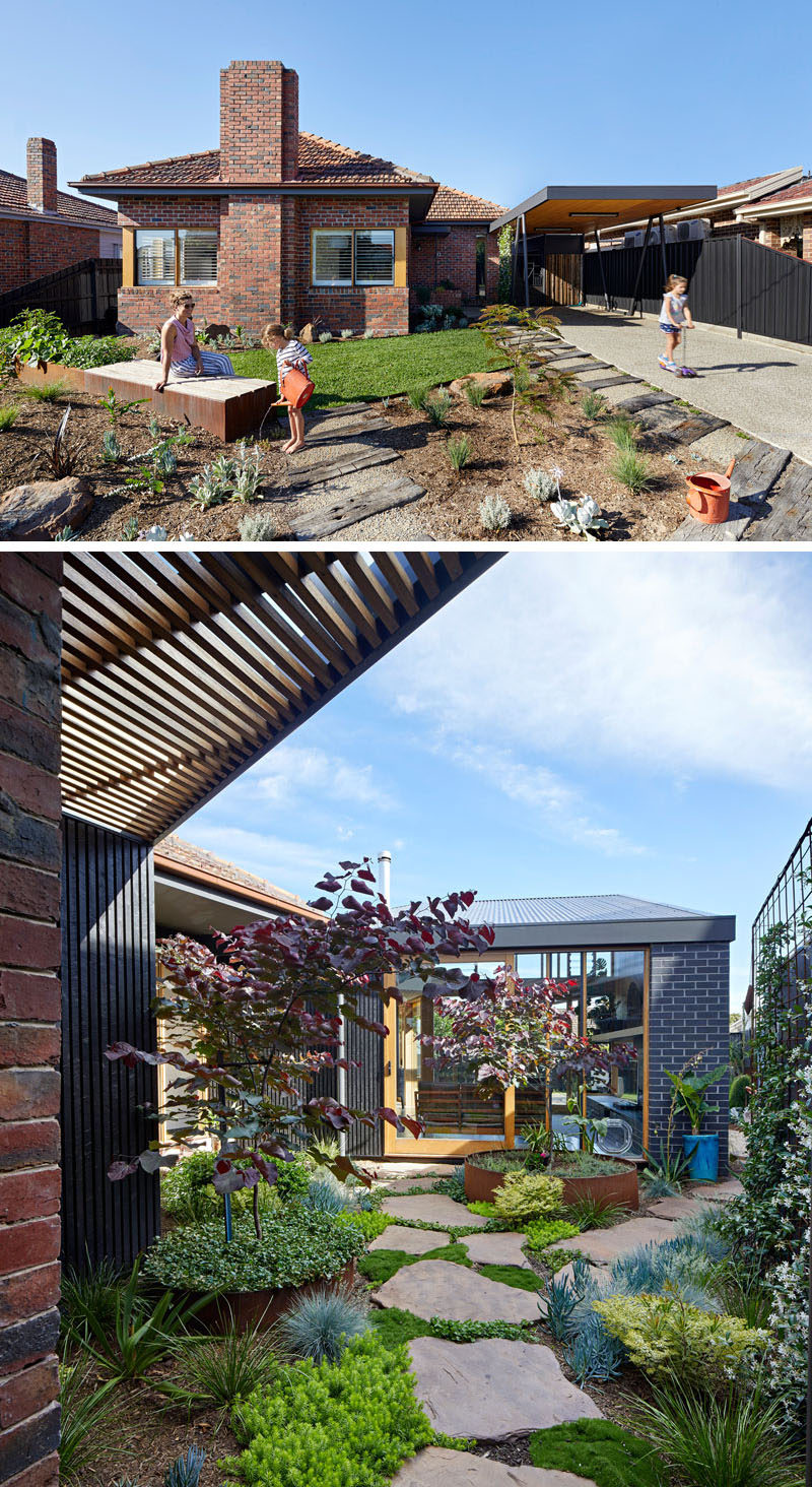 The original 1960s brick house has a new carport and a pathway that connects to a new addition. #Landscaping #Garden