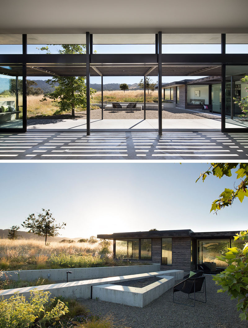 The outdoor spaces of this modern house have a view of the green roof that's on top of the garage, and it acts as an extension of the surrounding prairie. #ModernOutdoors #ModernHouse #GreenRoof
