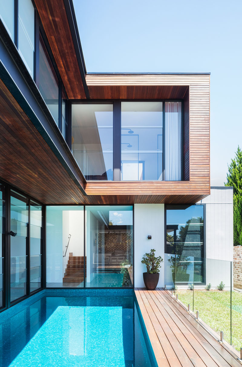 This modern house has a long swimming pool that's adjacent to the house. #SwimmingPool