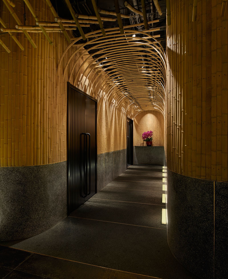 Design Detail - Imafuku Architects designed a Japanese restaurant that features a bamboo entryway that uses bamboo strips to create an arch on the ceiling. #Bamboo #RestaurantDesign #InteriorDesign