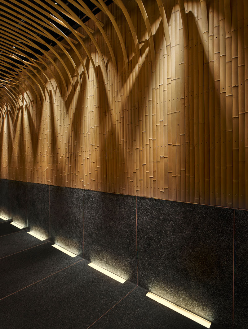 Design Detail - Imafuku Architects designed a Japanese restaurant that features a bamboo entryway that uses bamboo strips to create an arch on the ceiling. #Bamboo #RestaurantDesign #InteriorDesign