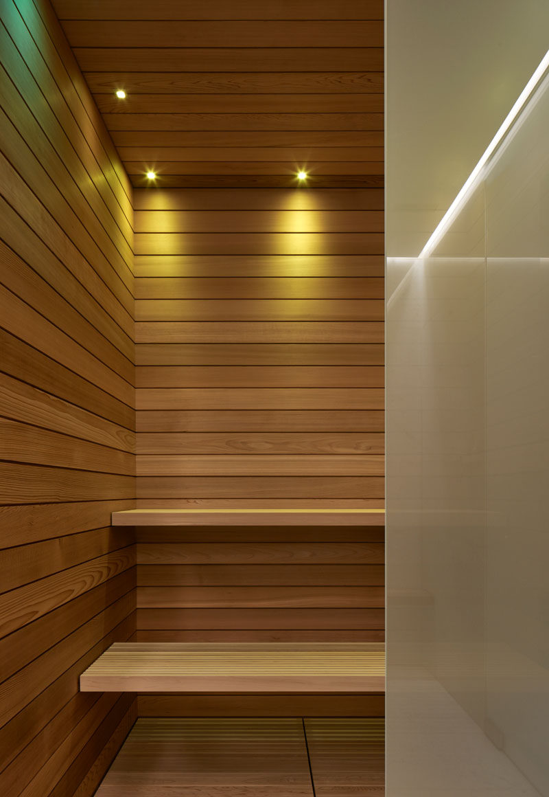 This wood-lined sauna is part of a modern pool house. #Sauna